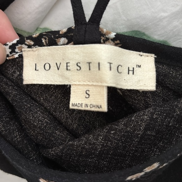 Lovestitch black dress with adjustable cross straps and asymmetrical bottom. - Picture 2 of 3